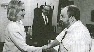 Hillary Greets Saddam’s Messenger